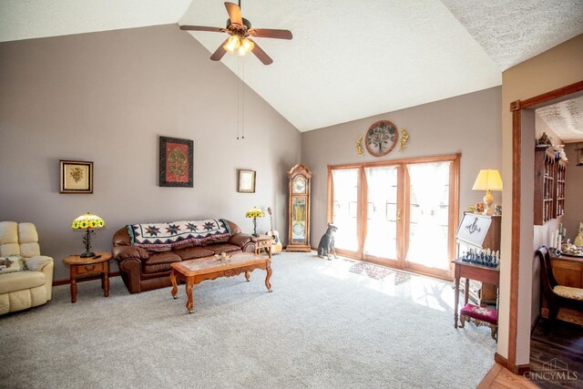 343 Whiteoak Dr, Wilmington, OH 45177 - carpeted living room featuring high vaulted ceiling, a ceiling fan, a textured ceiling, and baseboards