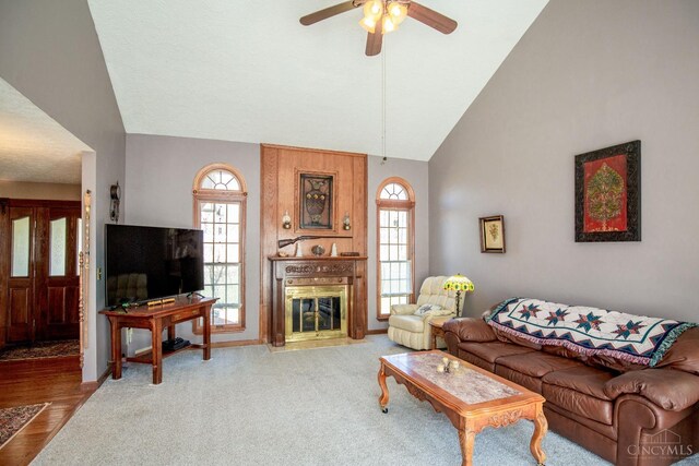 343 Whiteoak Dr, Wilmington, OH 45177 - living area featuring ceiling fan, high vaulted ceiling, healthy amount of natural light, and a fireplace with flush hearth