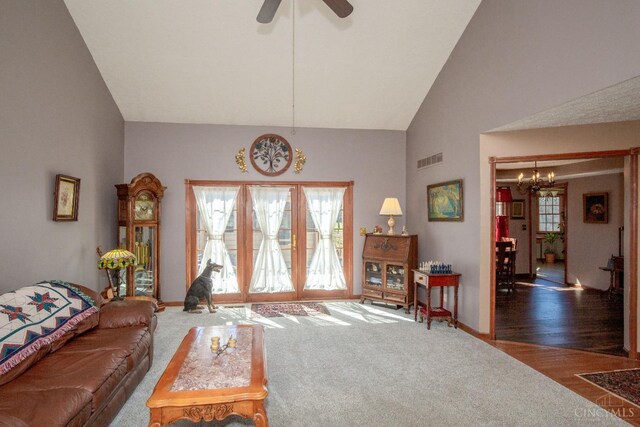 343 Whiteoak Dr, Wilmington, OH 45177 - living area featuring a chandelier, carpet floors, high vaulted ceiling, ceiling fan, and baseboards