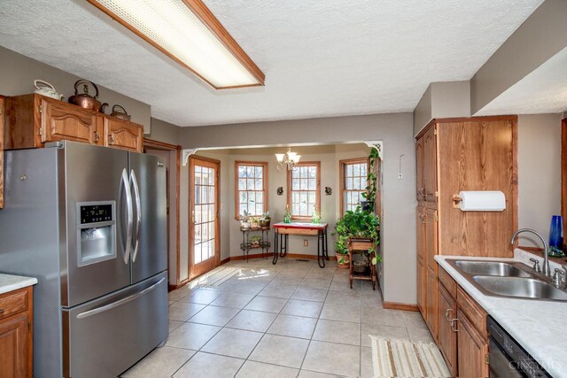 343 Whiteoak Dr, Wilmington, OH 45177 - kitchen featuring stainless steel fridge with ice dispenser, a sink, black dishwasher, brown cabinets, and light countertops