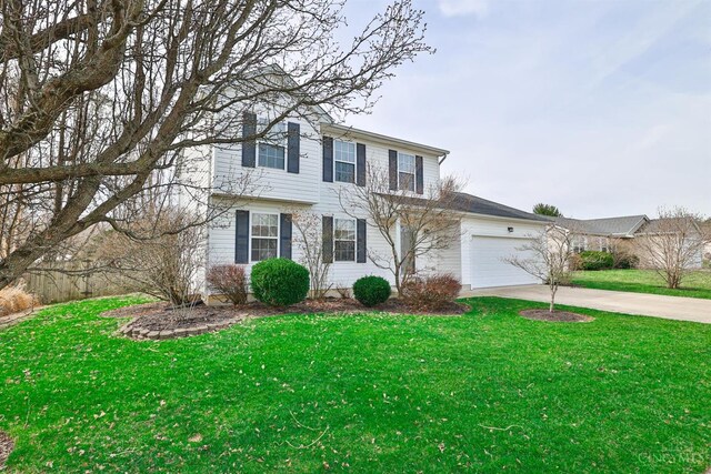view of front of home featuring a front lawn, an attached garage, and concrete driveway