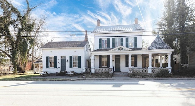 view of front of home with entry steps and a porch