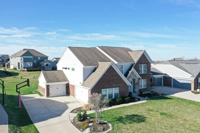 traditional home featuring driveway, brick siding, a shingled roof, a front lawn, and a residential view