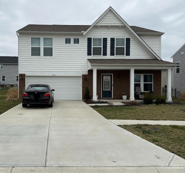 view of front of home featuring brick siding, covered porch, concrete driveway, and a garage