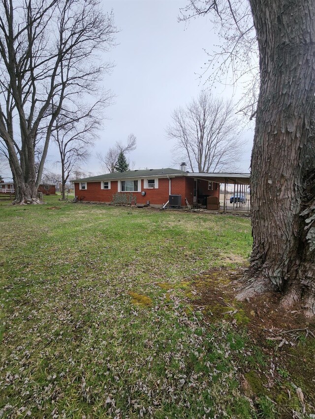 view of yard with central air condition unit