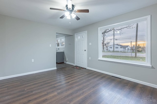 8354 Pippin Rd, Colerain Twp, OH 45239 - unfurnished living room with a ceiling fan, dark wood-style floors, baseboards, and visible vents