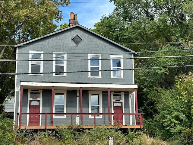 2450 River Rd, Cincinnati, OH 45204 - view of front facade featuring covered porch and a chimney
