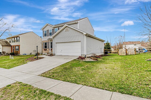 traditional home featuring driveway, a garage, fence, and a front lawn