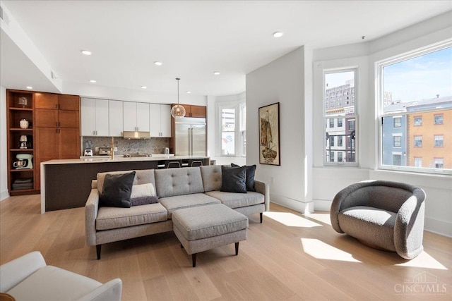 32 E Court St Unit 201, Cincinnati, OH 45202 - living room featuring baseboards, light wood finished floors, and recessed lighting