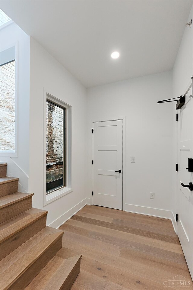 32 E Court St Unit 201, Cincinnati, OH 45202 - interior space with baseboards, recessed lighting, light wood-style floors, and stairway