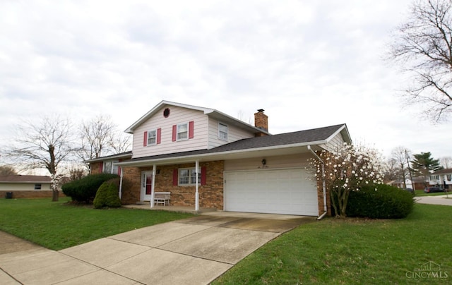 traditional home featuring a garage, a chimney, concrete driveway, a front yard, and brick siding