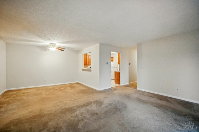 7918 Jessies Way Unit 201, Fairfield Twp, OH 45011 - spare room featuring ceiling fan, light carpet, baseboards, and a textured ceiling