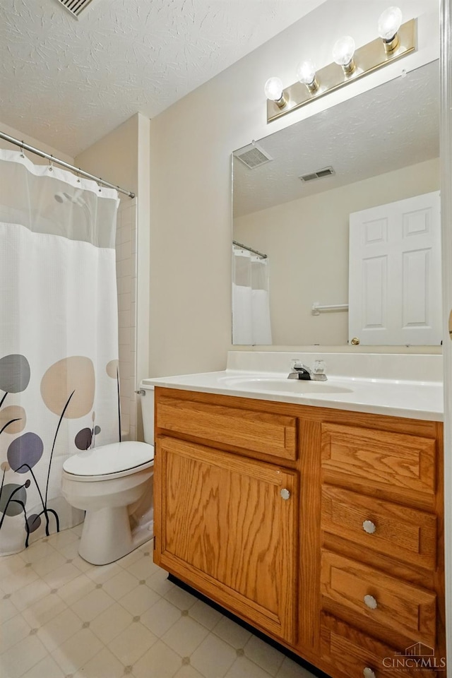7918 Jessies Way Unit 201, Fairfield Twp, OH 45011 - bathroom with tile patterned floors, vanity, toilet, and a textured ceiling