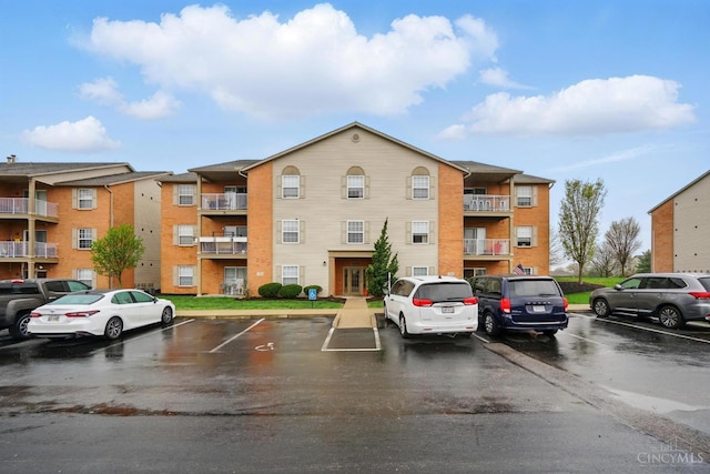 7918 Jessies Way Unit 201, Fairfield Twp, OH 45011 - view of apartment building / complex with uncovered parking