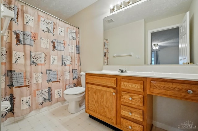 7918 Jessies Way Unit 201, Fairfield Twp, OH 45011 - bathroom featuring toilet, vanity, tile patterned floors, ceiling fan, and curtained shower