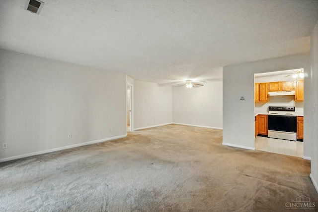 7918 Jessies Way Unit 201, Fairfield Twp, OH 45011 - unfurnished living room with a ceiling fan, light carpet, and baseboards