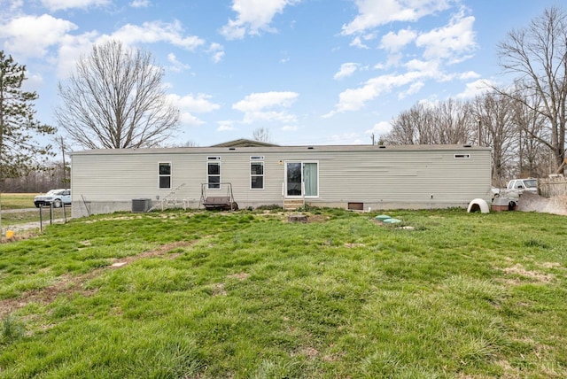 back of property with central AC