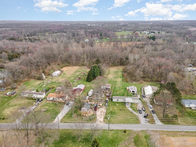 view of property location featuring a forest