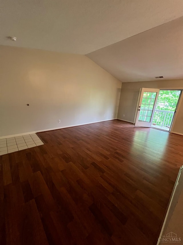 3701 W Galbraith Rd Unit 52, Colerain Twp, OH 45247 - empty room with wood finished floors, lofted ceiling, baseboards, and a smoke detector