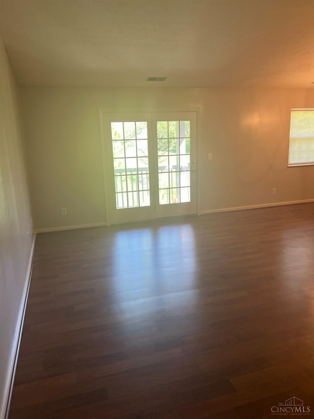 3701 W Galbraith Rd Unit 52, Colerain Twp, OH 45247 - empty room featuring dark wood finished floors and baseboards