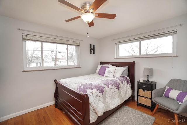 5826 Willow Oak Ln, Green Twp, OH 45239 - bedroom featuring wood finished floors, baseboards, and a ceiling fan