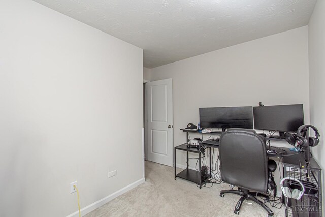office area featuring carpet and baseboards