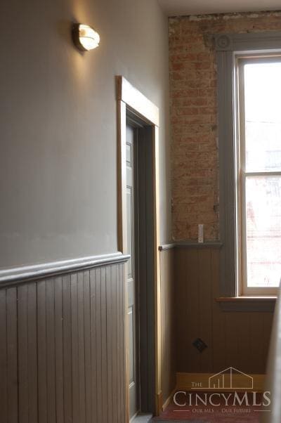 interior space with wooden walls and plenty of natural light