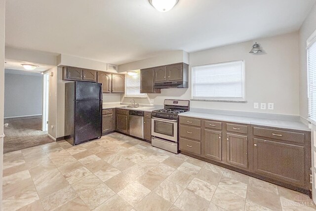3236 Deborah Ln, Green Twp, OH 45239 - kitchen featuring baseboards, a sink, light countertops, appliances with stainless steel finishes, and under cabinet range hood