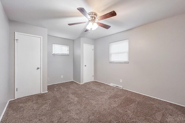 3236 Deborah Ln, Green Twp, OH 45239 - unfurnished bedroom with carpet flooring, a ceiling fan, and visible vents