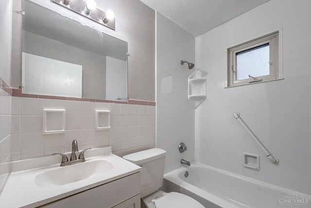 3236 Deborah Ln, Green Twp, OH 45239 - bathroom with toilet, vanity, shower / tub combination, and tile walls