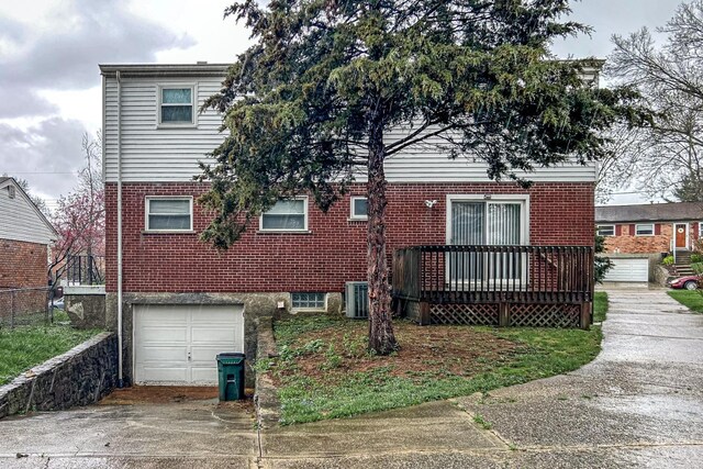3236 Deborah Ln, Green Twp, OH 45239 - back of property featuring an attached garage, driveway, and brick siding