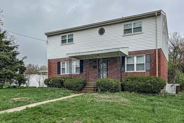 3236 Deborah Ln, Green Twp, OH 45239 - view of front of property with brick siding, fence, and a front lawn