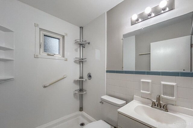 3236 Deborah Ln, Green Twp, OH 45239 - bathroom with toilet, tile walls, vanity, and walk in shower