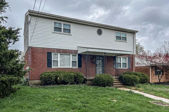 3236 Deborah Ln, Green Twp, OH 45239 - traditional-style house featuring a front yard and brick siding