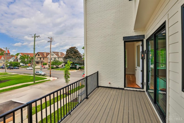 wooden deck featuring a residential view