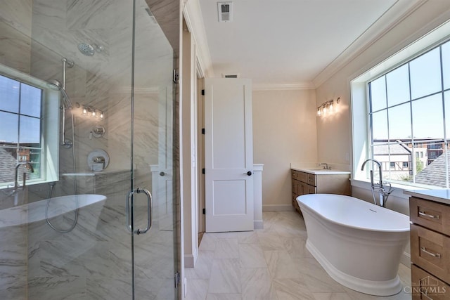 full bath featuring vanity, a shower stall, ornamental molding, a soaking tub, and baseboards