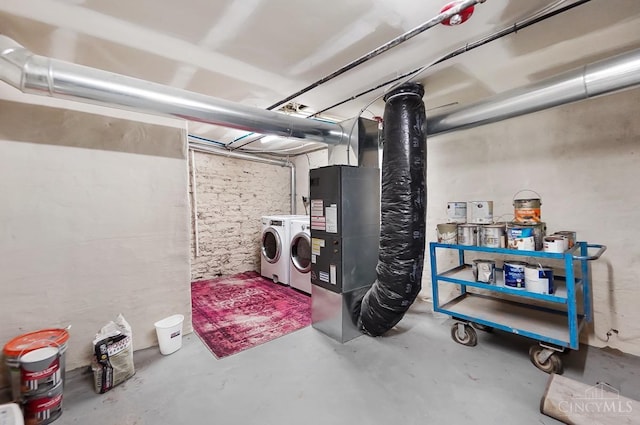 unfinished below grade area featuring washing machine and dryer