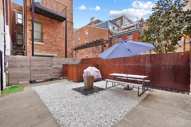 view of patio / terrace featuring fence