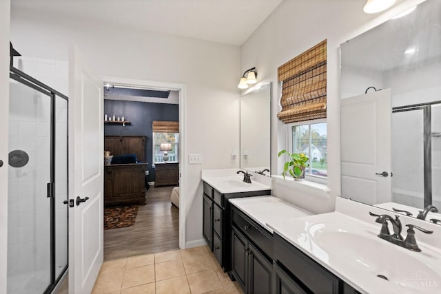 1113 Clover Field Dr, Miami Twp, OH 45140 - full bathroom featuring ensuite bathroom, a shower stall, vanity, tile patterned floors, and baseboards
