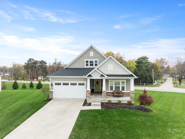 1113 Clover Field Dr, Miami Twp, OH 45140 - craftsman-style home with driveway, stone siding, and a front lawn