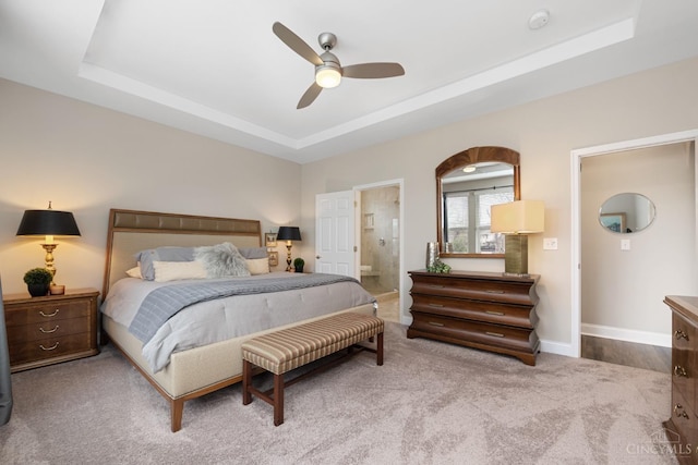 2612 Virgie Ct, Deerfield Twp, OH 45140 - carpeted bedroom with a tray ceiling, ensuite bath, a ceiling fan, and baseboards