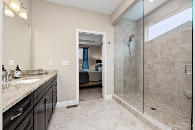 2612 Virgie Ct, Deerfield Twp, OH 45140 - ensuite bathroom featuring tile patterned floors, vanity, ensuite bath, baseboards, and tiled shower