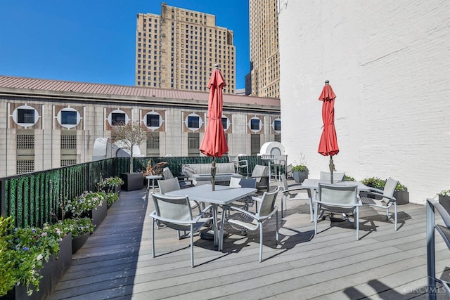 wooden deck featuring outdoor dining space