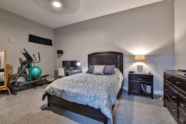 carpeted bedroom featuring baseboards and ceiling fan