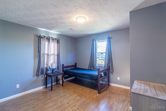 819 E Main St, West Union, OH 45693 - bedroom featuring baseboards and light wood finished floors