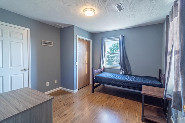 819 E Main St, West Union, OH 45693 - bedroom with wood finished floors and a closet