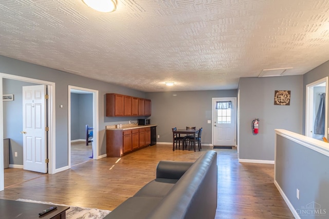 819 E Main St, West Union, OH 45693 - living area with wood finished floors and baseboards