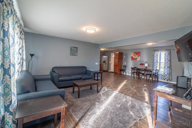 819 E Main St, West Union, OH 45693 - living room featuring wood finished floors and baseboards