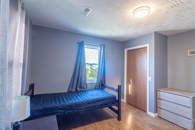 819 E Main St, West Union, OH 45693 - bedroom featuring light wood-style flooring and a closet