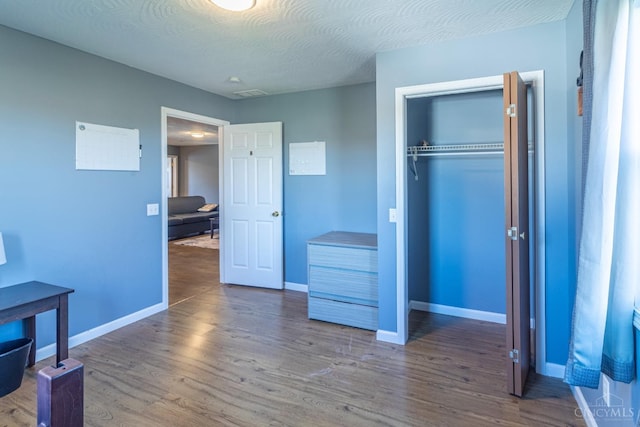 819 E Main St, West Union, OH 45693 - unfurnished bedroom featuring wood finished floors and a closet
